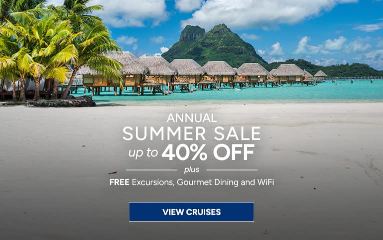 Oceania Cruises summer sale featuring scenic tropical limestone cliffs and turquoise waters, advertising up to 40% off with free excursions and gourmet dining.