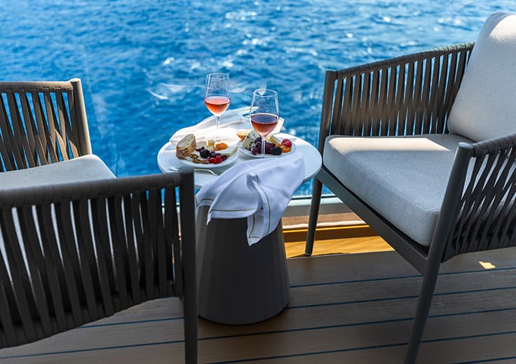 Oceania Cruises veranda stateroom, wine and cheese on balcony